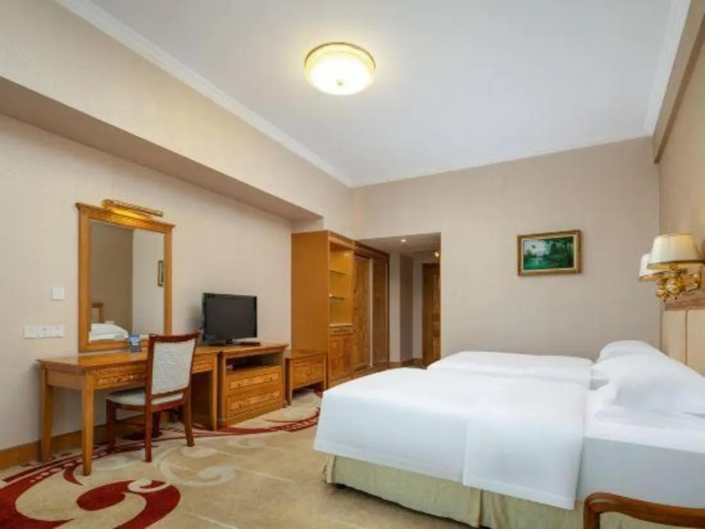 Bed in Zhuhai Dehan Hotel
