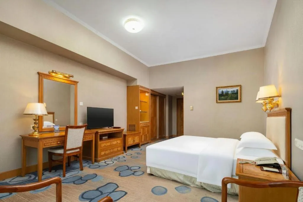 Bed in Zhuhai Dehan Hotel