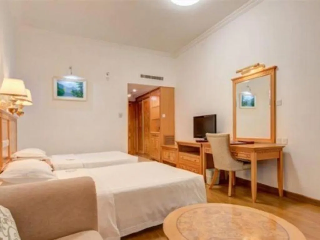 Bed in Zhuhai Dehan Hotel