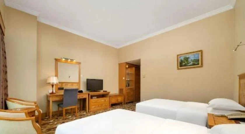 Bed in Zhuhai Dehan Hotel