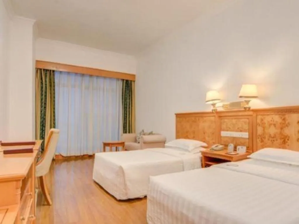 Bed in Zhuhai Dehan Hotel