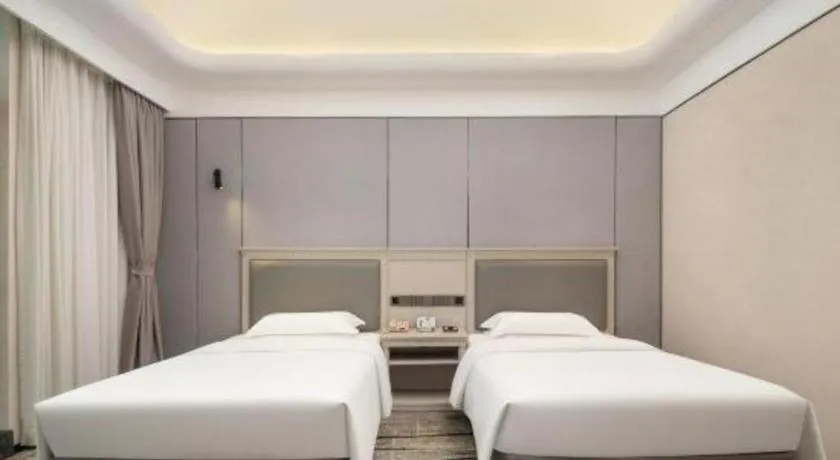 Bed in Zhuhai Dehan Hotel