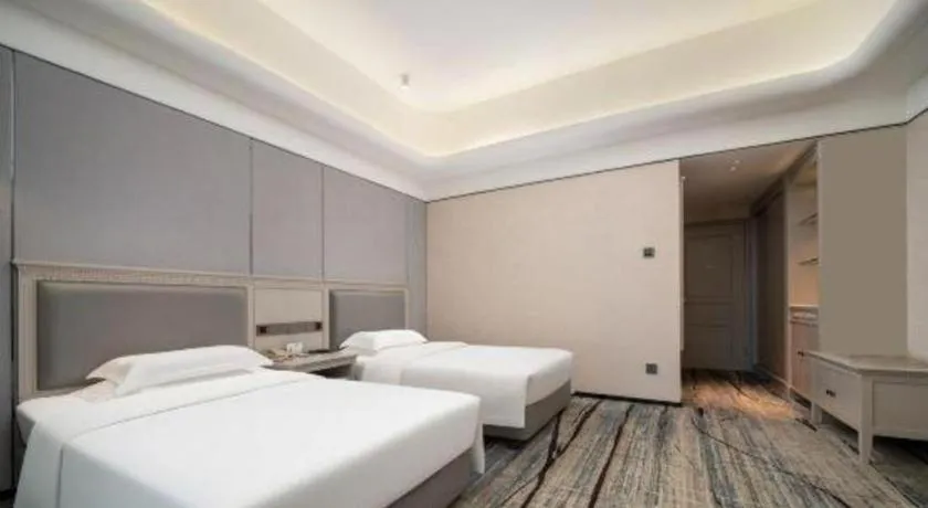 Bed in Zhuhai Dehan Hotel
