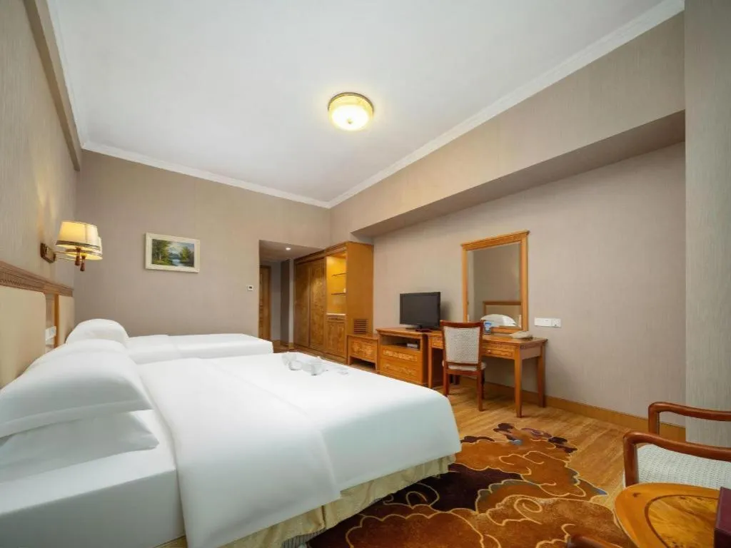 Bed in Zhuhai Dehan Hotel