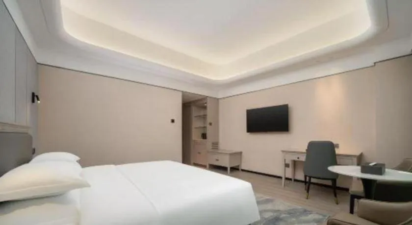 Bed in Zhuhai Dehan Hotel