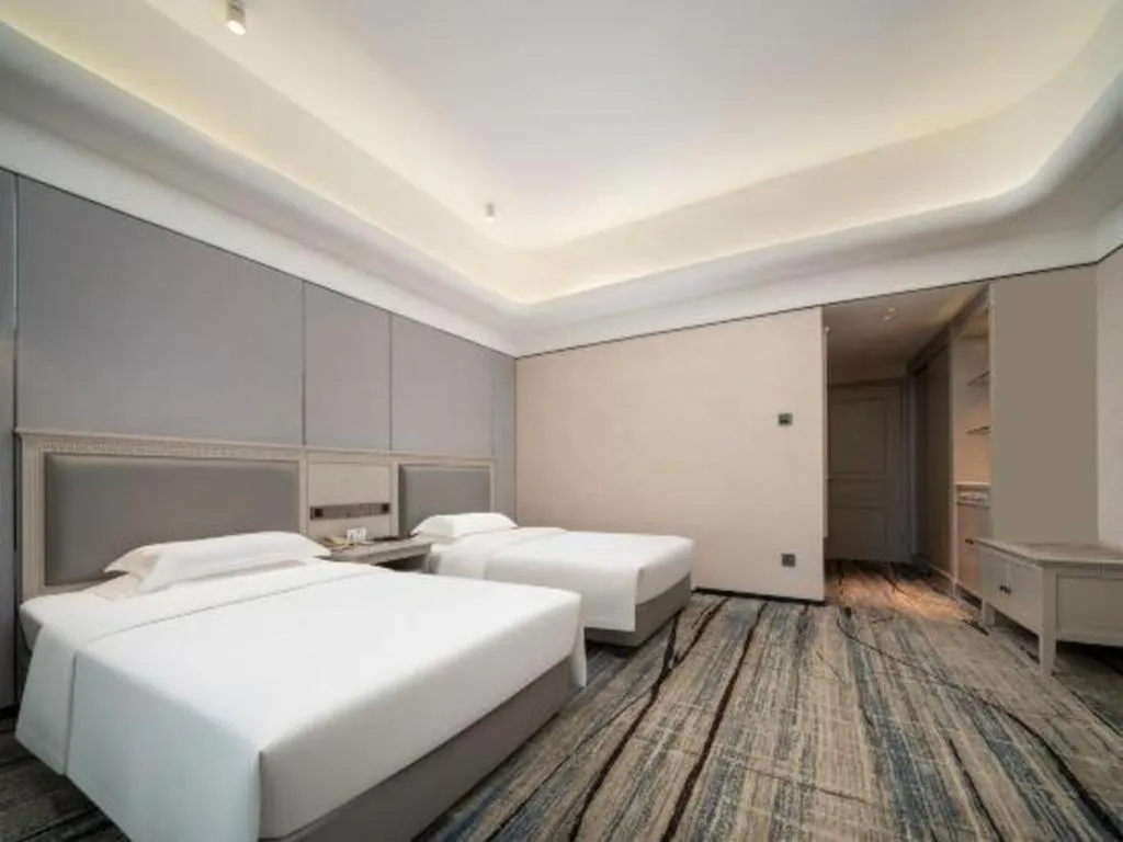 Bed in Zhuhai Dehan Hotel