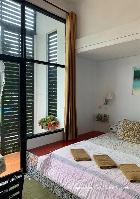 Bed in Sweet Garden Home Resort