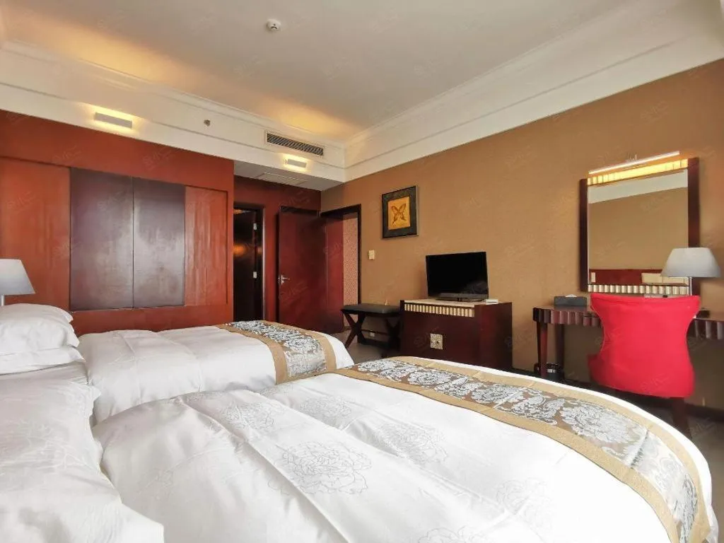 Bed in Hua Xia Pearl Hotel