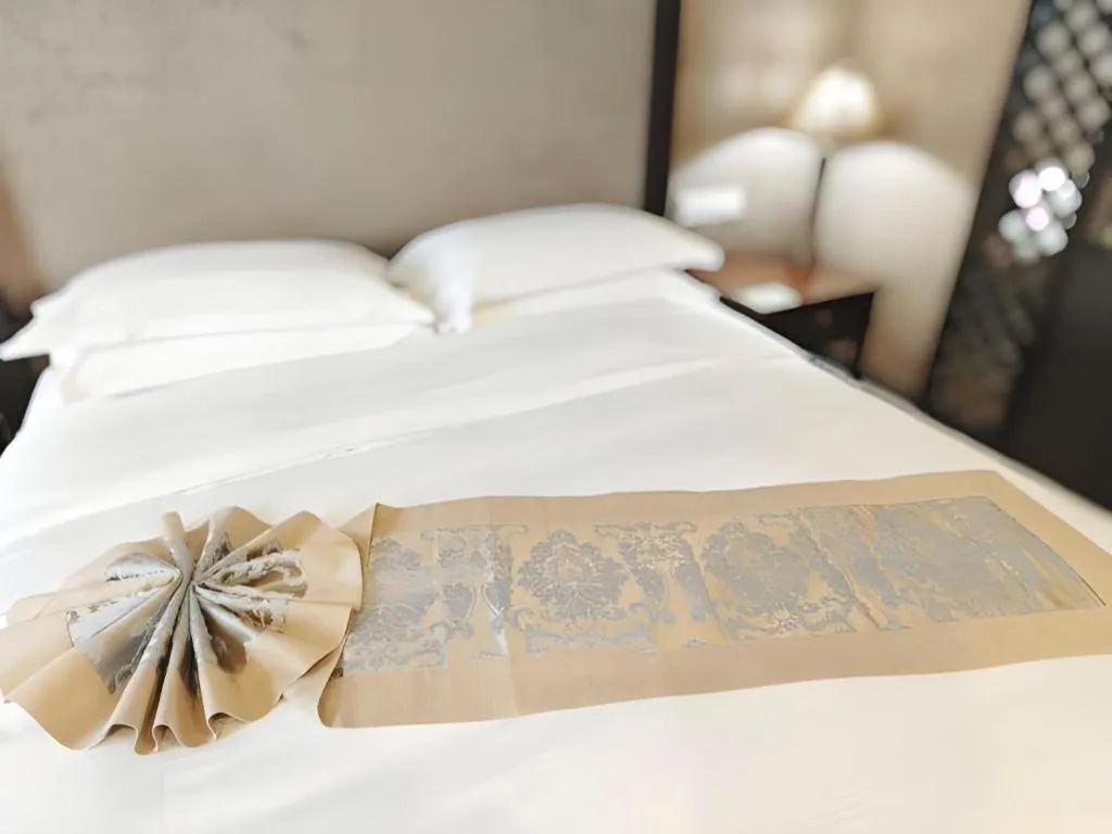 Bed in Hua Xia Pearl Hotel