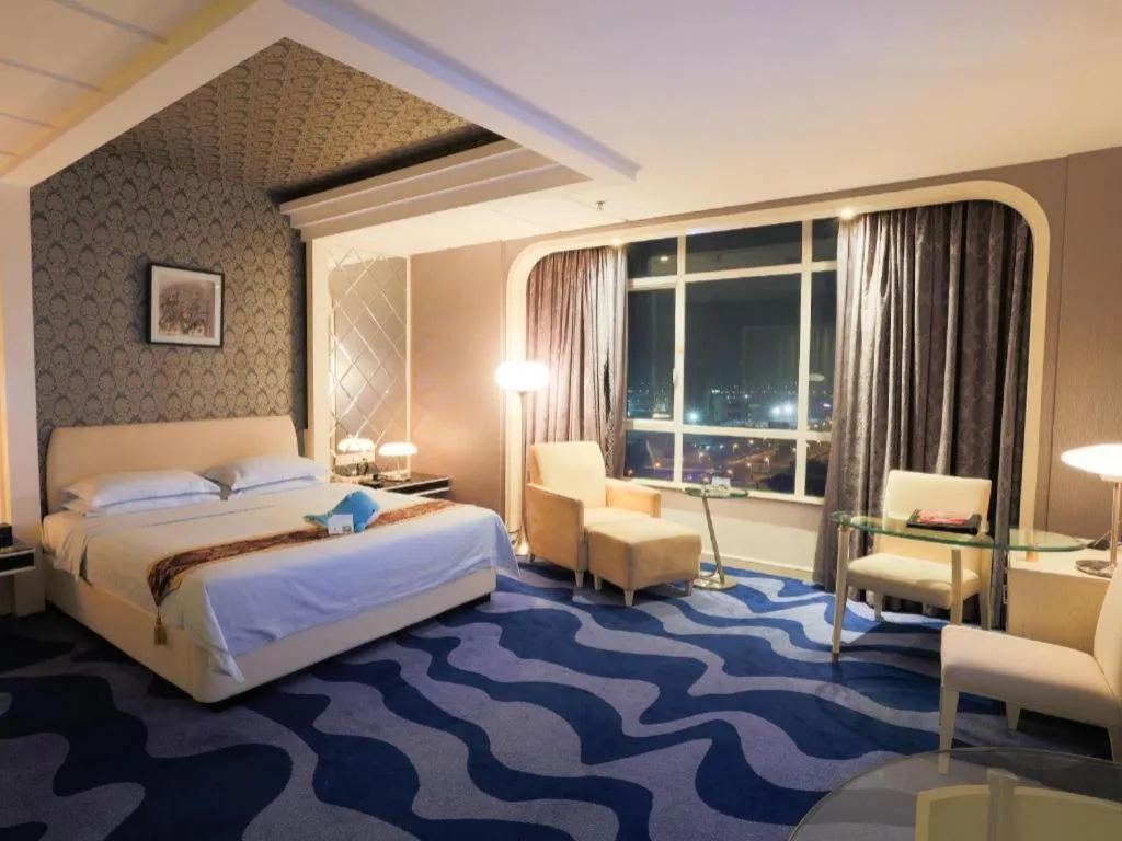 Bed in Hua Xia Pearl Hotel