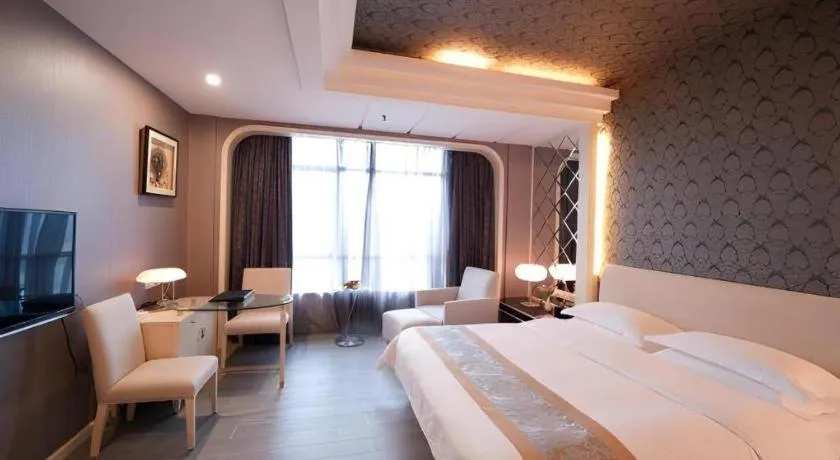 Bed in Hua Xia Pearl Hotel