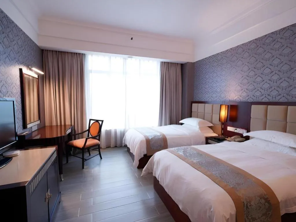 Bed in Hua Xia Pearl Hotel