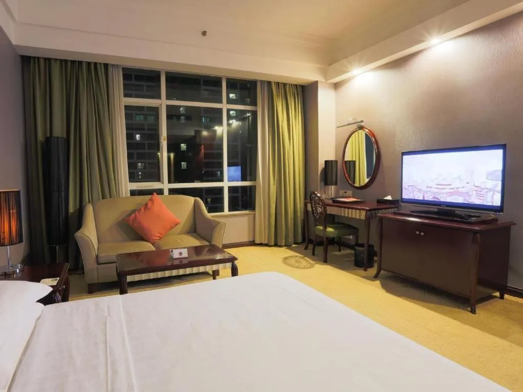 Bed in Hua Xia Pearl Hotel