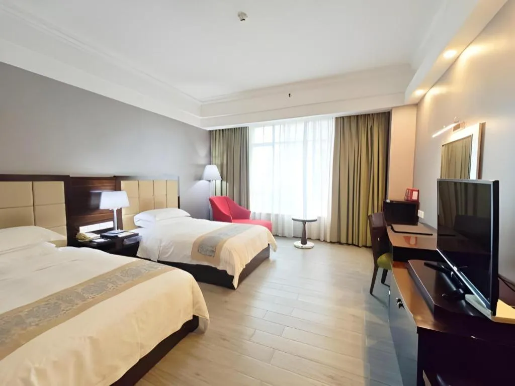 Bed in Hua Xia Pearl Hotel