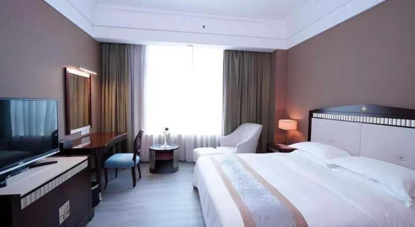 Bed in Hua Xia Pearl Hotel