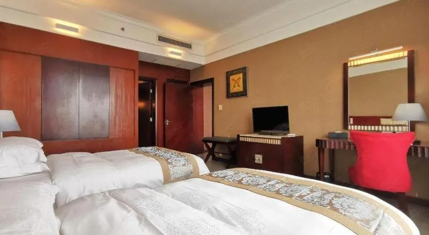 Bed in Hua Xia Pearl Hotel