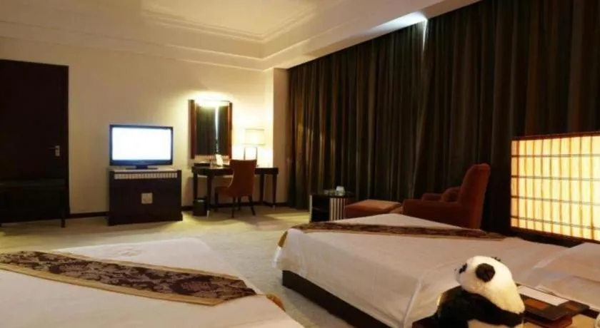 Bed in Hua Xia Pearl Hotel