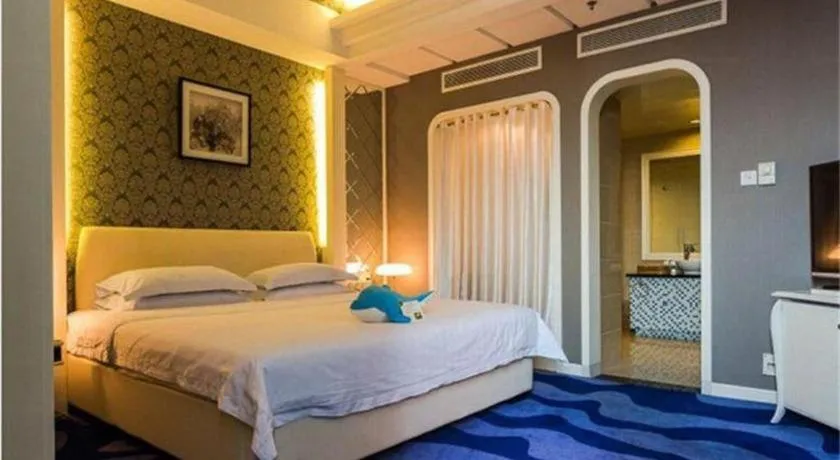 Bed in Hua Xia Pearl Hotel