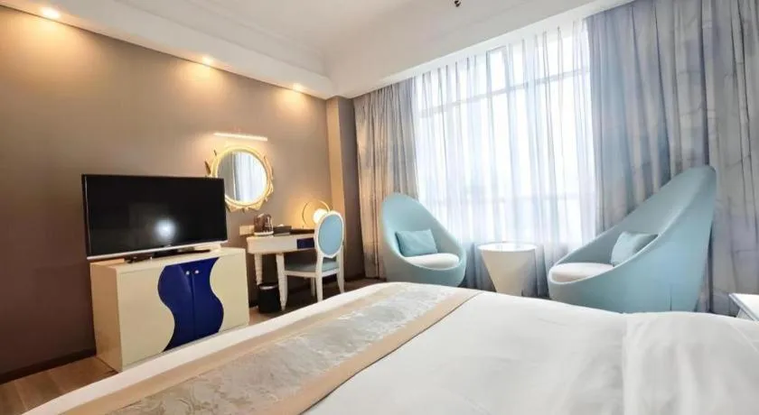 Bed in Hua Xia Pearl Hotel