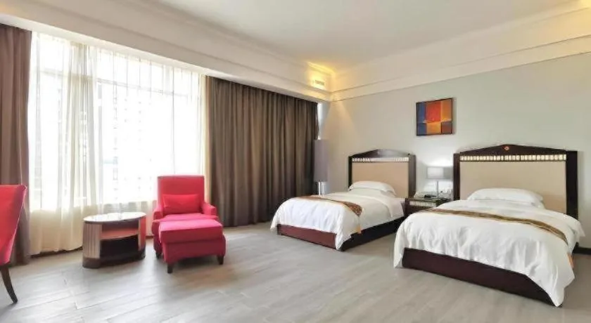 Bed in Hua Xia Pearl Hotel