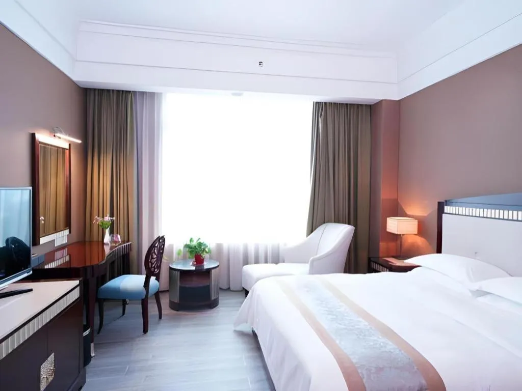 Bed in Hua Xia Pearl Hotel