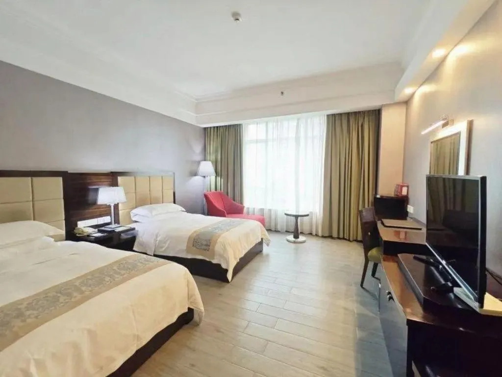 Bed in Hua Xia Pearl Hotel