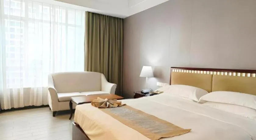 Bed in Hua Xia Pearl Hotel