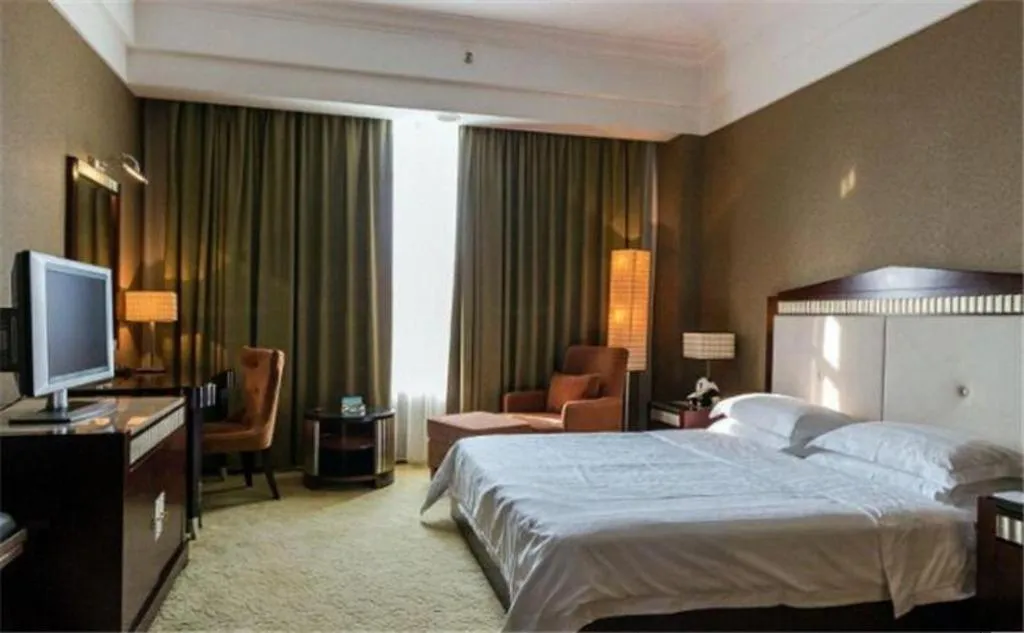 Bed in Hua Xia Pearl Hotel