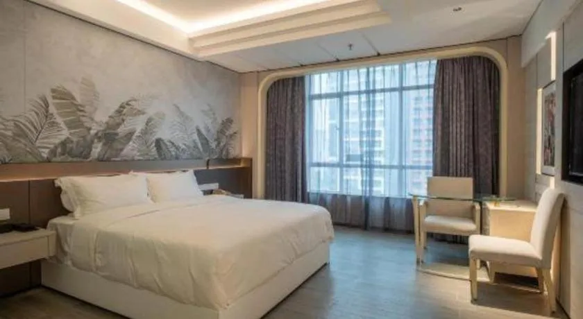 Bed in Hua Xia Pearl Hotel