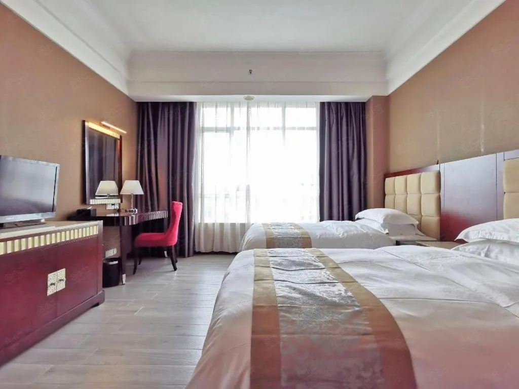 Bed in Hua Xia Pearl Hotel