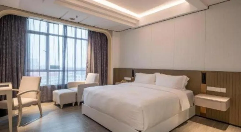 Bed in Hua Xia Pearl Hotel