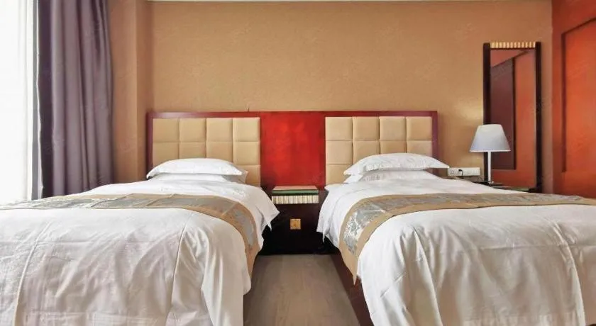 Bed in Hua Xia Pearl Hotel