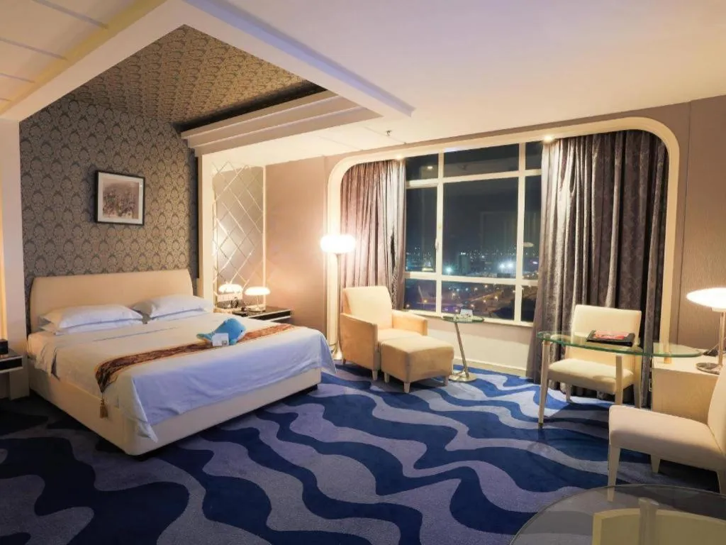 Bed in Hua Xia Pearl Hotel