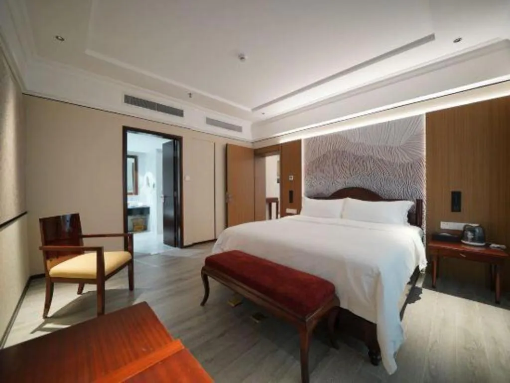 Bed in Hua Xia Pearl Hotel