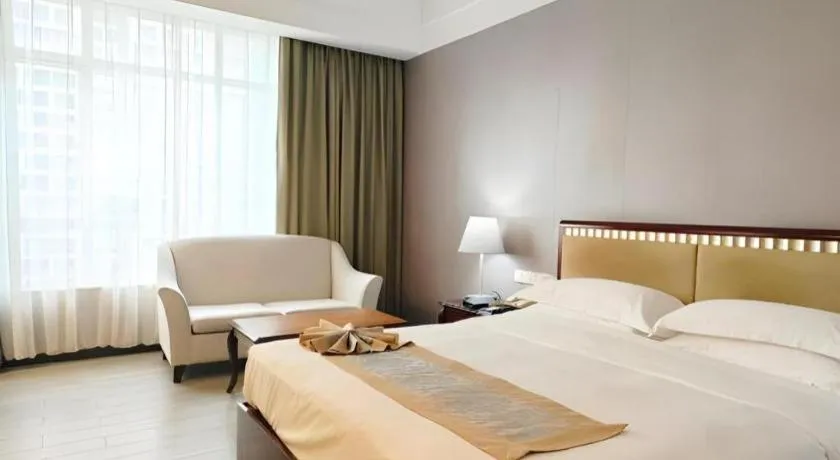 Bed in Hua Xia Pearl Hotel