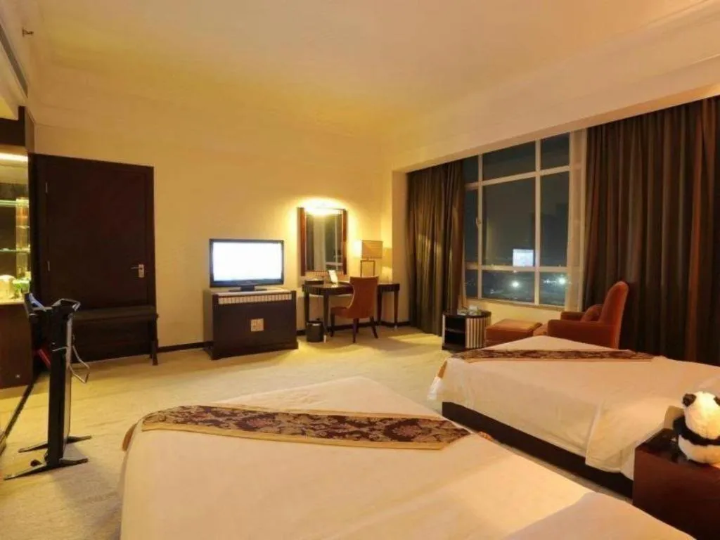 Bed in Hua Xia Pearl Hotel