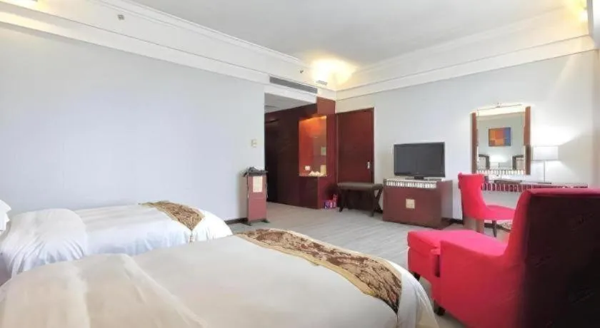 Bed in Hua Xia Pearl Hotel