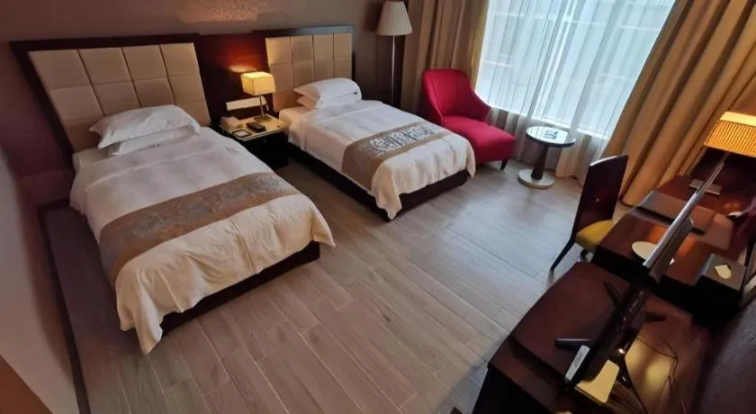 Bed in Hua Xia Pearl Hotel