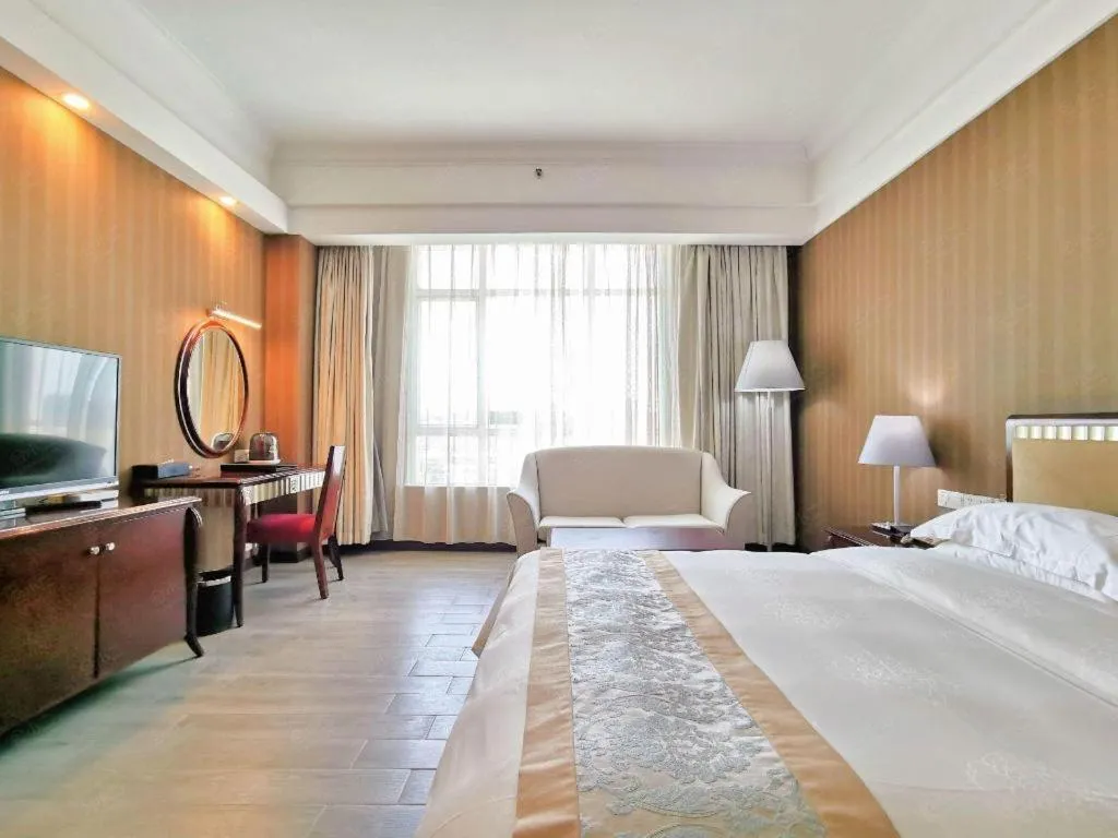 Bed in Hua Xia Pearl Hotel