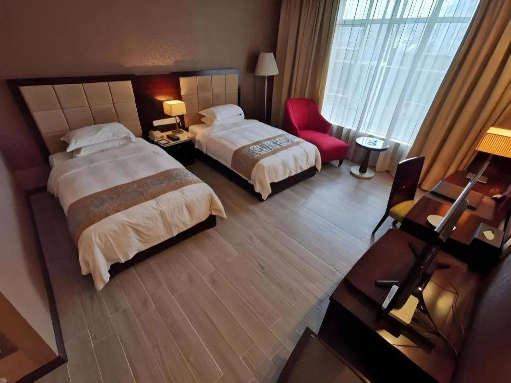 Bed in Hua Xia Pearl Hotel