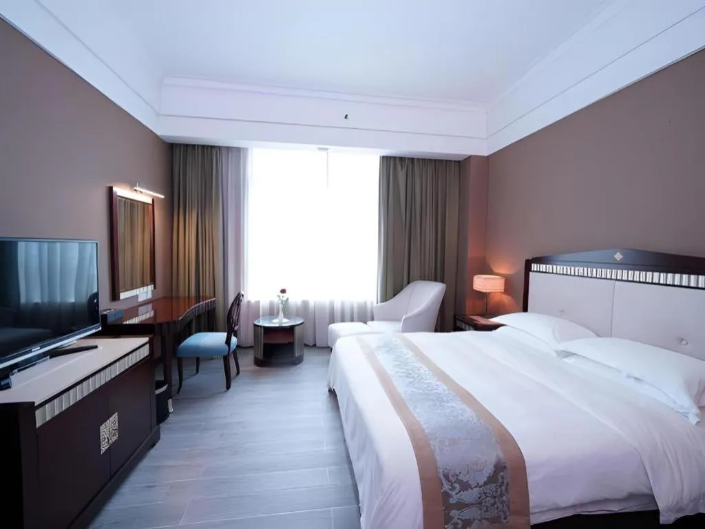 Bed in Hua Xia Pearl Hotel