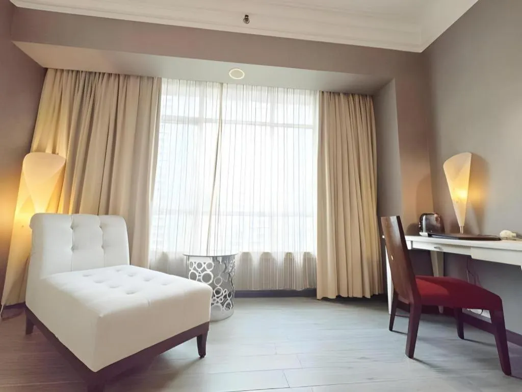 Bed in Hua Xia Pearl Hotel