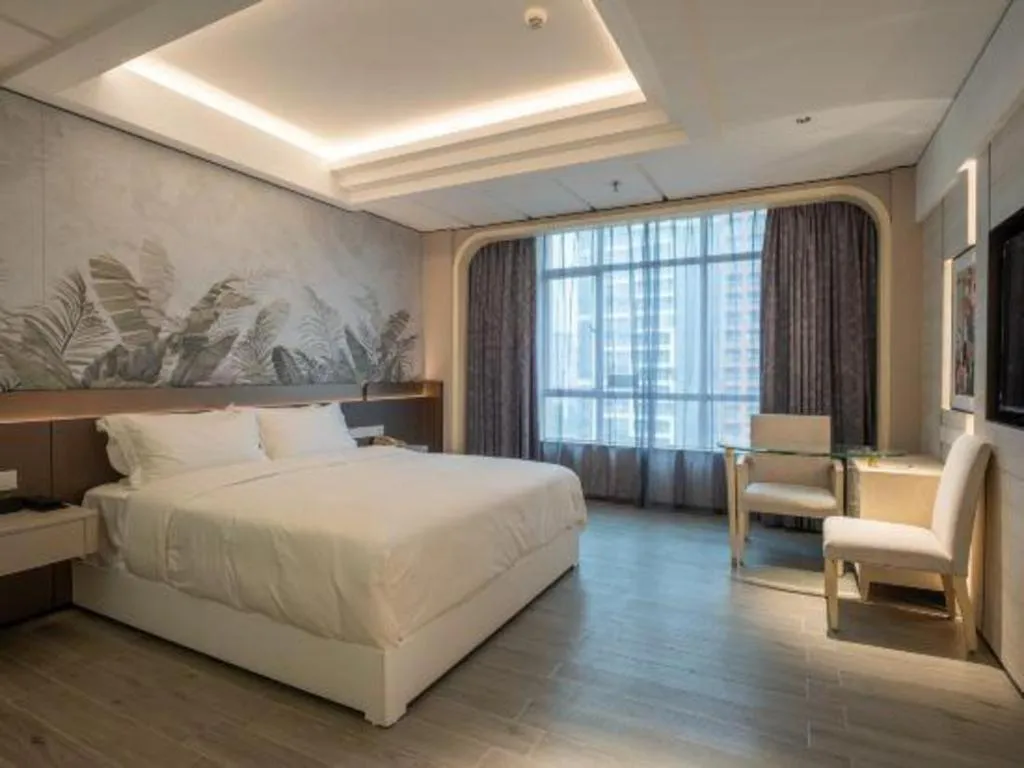 Bed in Hua Xia Pearl Hotel