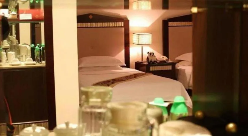 Bed in Hua Xia Pearl Hotel