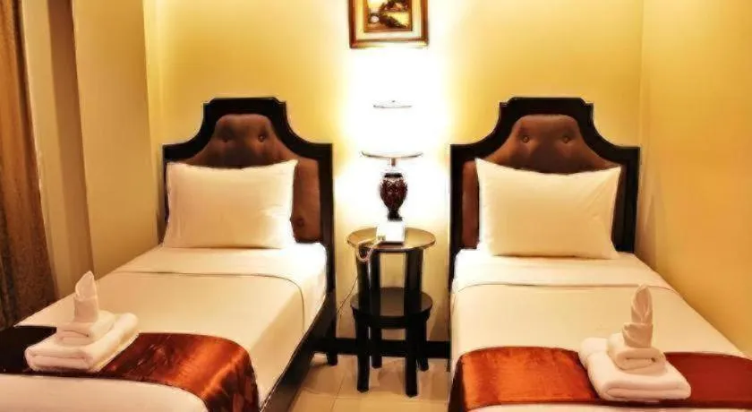 Bed in Peridot Suites