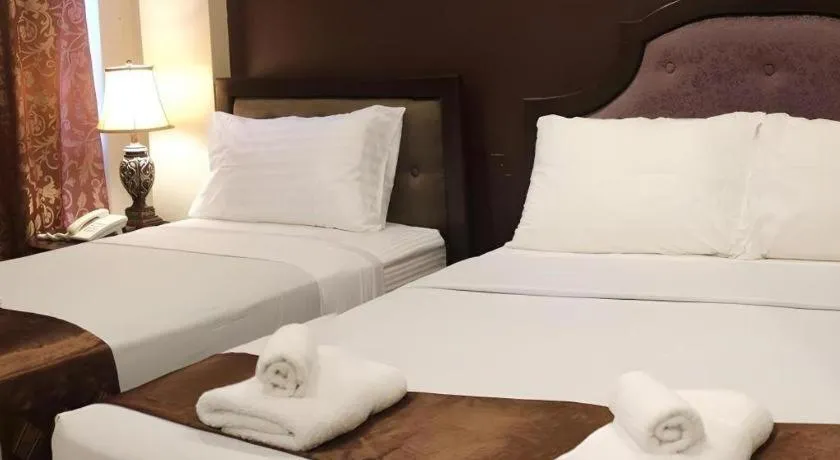 Bed in Peridot Suites