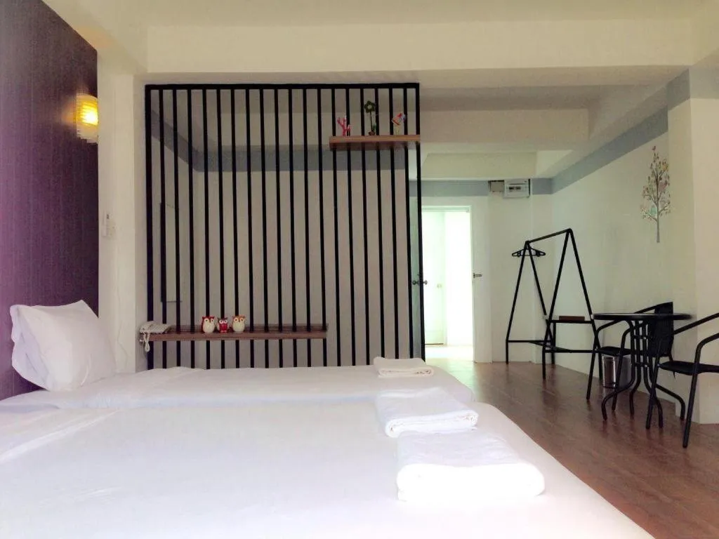 Bed in The Pride Hotel At Laemsing