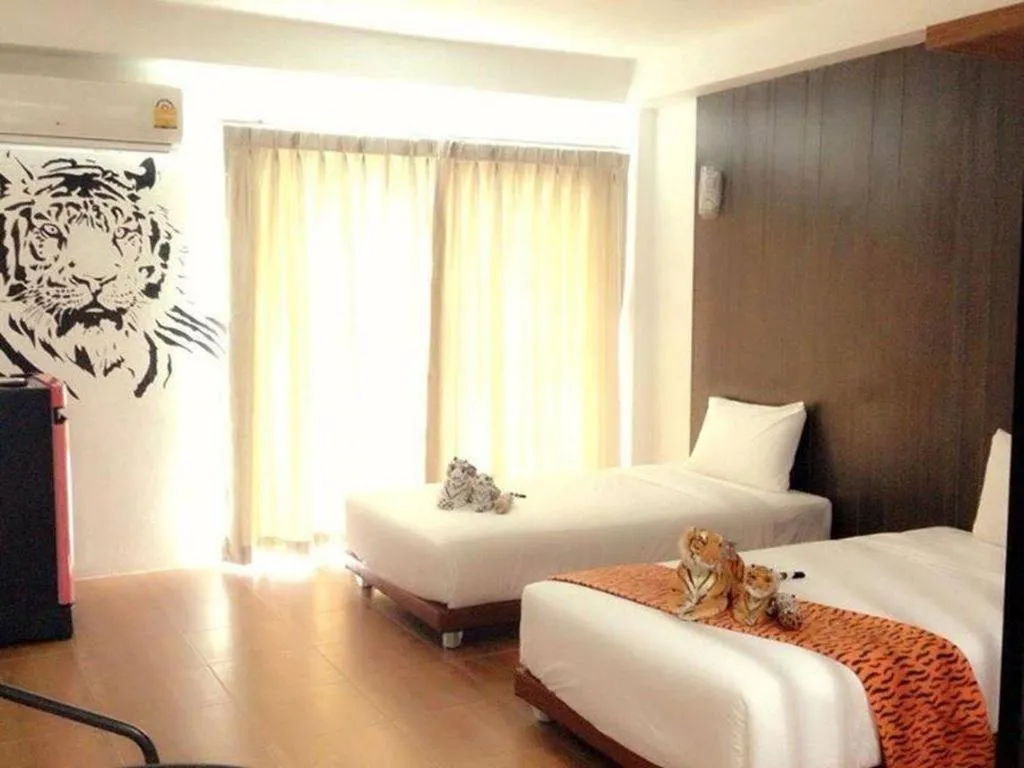 Bed in The Pride Hotel At Laemsing