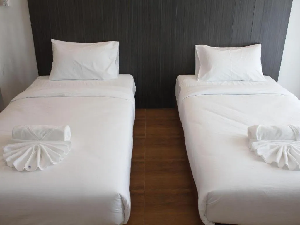 Bed in The Pride Hotel At Laemsing