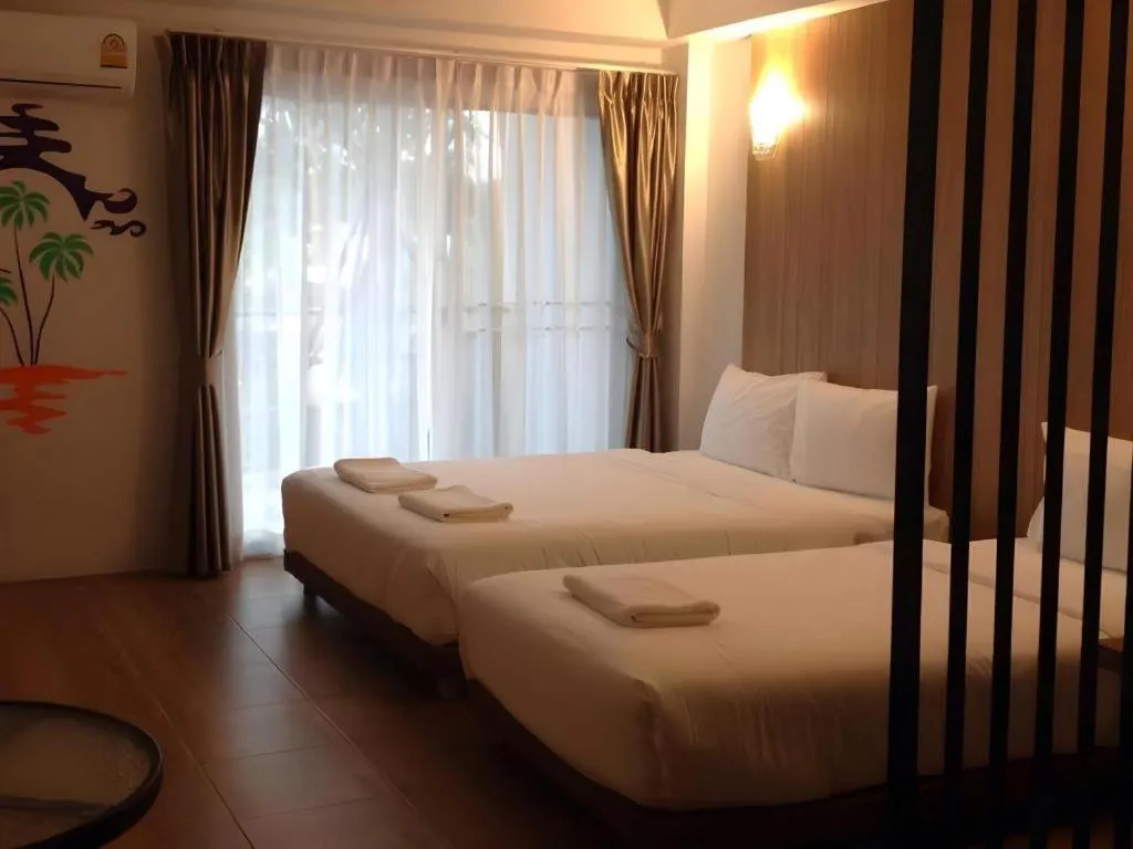 Bed in The Pride Hotel At Laemsing